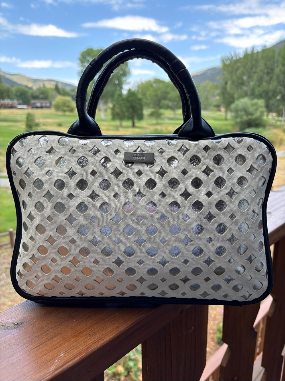 Jones New York Stylish White and Black Laser-Cut toiletry Satchel
